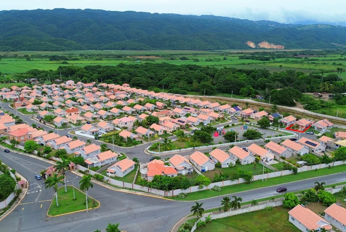 Aerial view of Caymanas Country Club Estate showing hundreds of homes across the gated community
